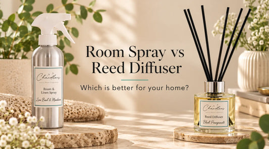 Luxury room spray and reed diffuser side by side in a neutral home setting, comparing two ways to fragrance your home.