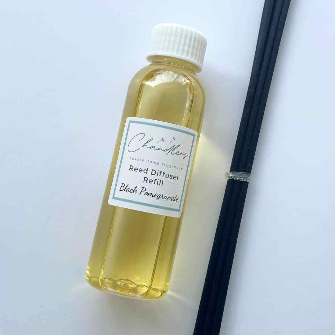Luxury reed diffuser refill bottle with black reeds by Chandlers